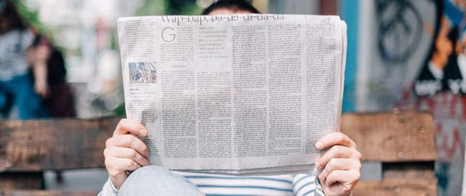 person reading a newspaper