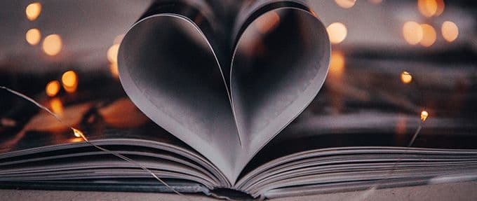 open book with pages making a heart