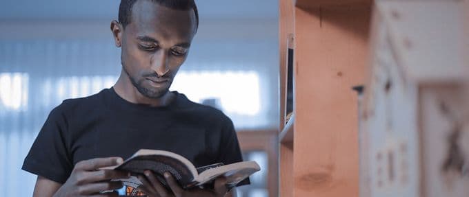 black man reading a book