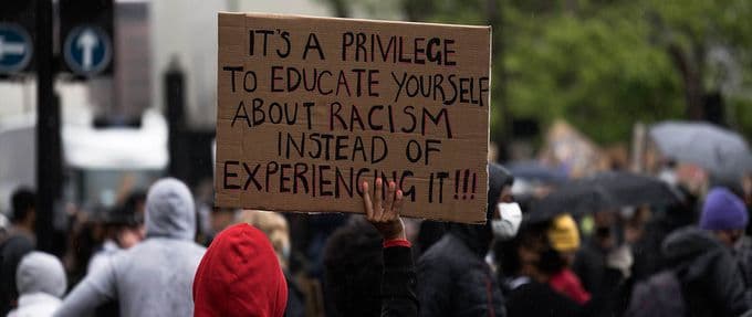 black lives matter protestor holding sign